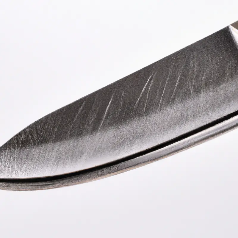 Serrated knife slicing kiwi.